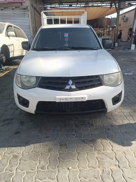 2013-model-mitsubishi-l200-4-door-pick-up-gcc-2013-model-mitsubishi-l200-4-door-just-buy-and-drive-64849714401281111
